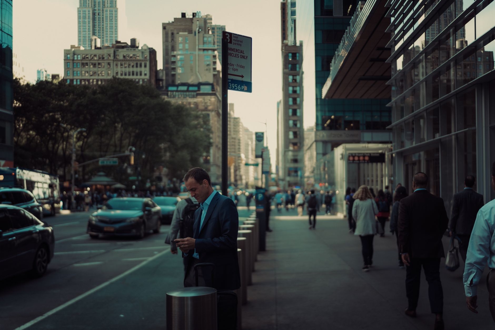 Street view in New York City with pedestrians and skyscrapers, capturing the urban hustle. — Understanding Forex Market Dynam